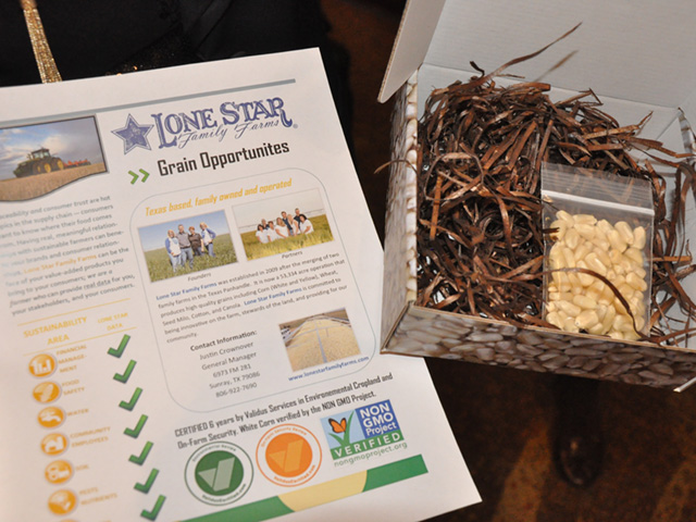 Lone Star Family Farms out of Texas put together a fact sheet and small package of white corn to give to potential grain buyers at an Organic and Non-GMO Forum this week in Minneapolis. (DTN photo by Chris Clayton)